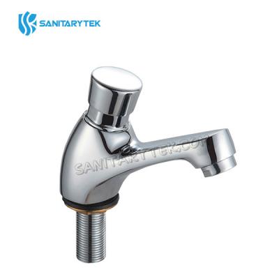 Self-closing basin tap
