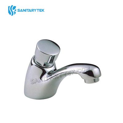 Self-closing delay basin tap