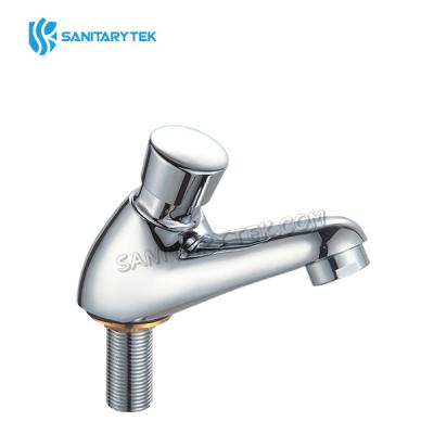 Self-closing pillar basin tap