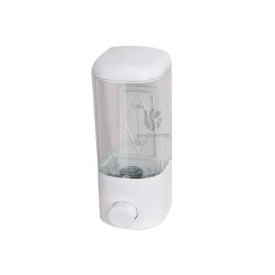 Wall mounted soap dispenser with manual push button